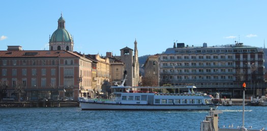 Piazza Garbialdi, Como see from then water side with boat in foreground