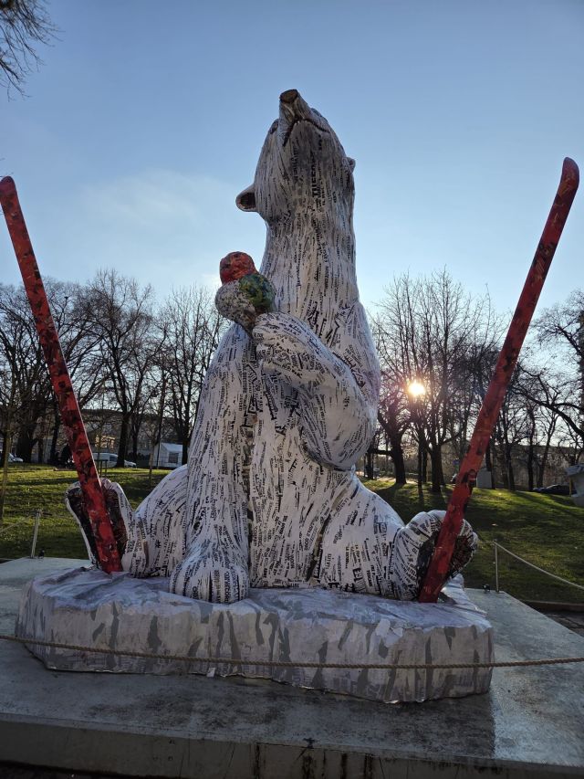 The peier maché sculoutre of a polar bear in front of Triennale Milano
